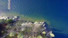 Aerial view of the clear shoreline of Lake Coeur d'Alene, Idaho.