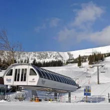 The Basin Express chairlift and snowy slopes at Schweitzer Mountain Resort.