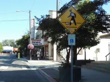A downtown Sandpoint street with the Panida Theater sign in the distance.