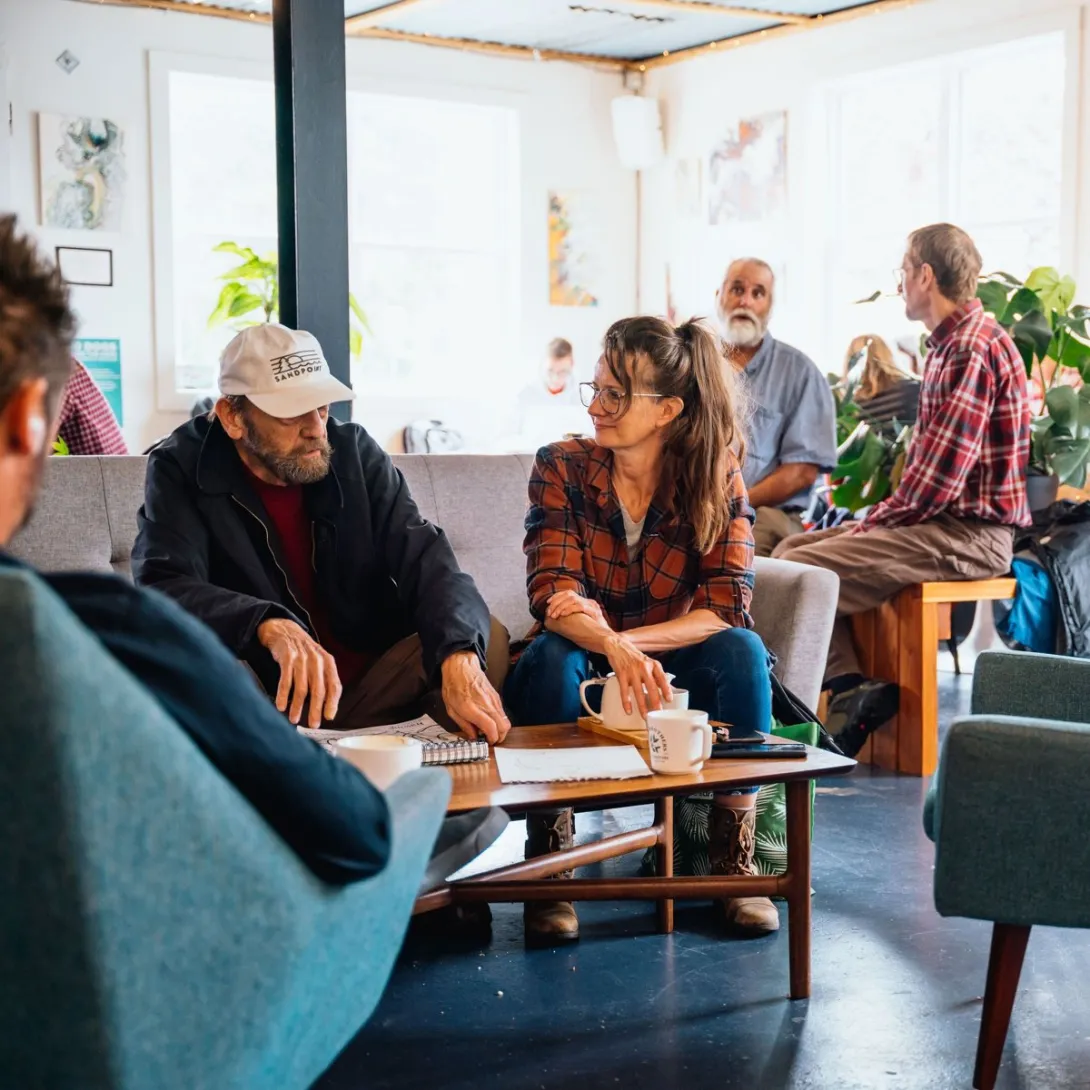Guests relax with coffee inside the Evans Brothers Coffee cafe next to its Sandpoint roastery.